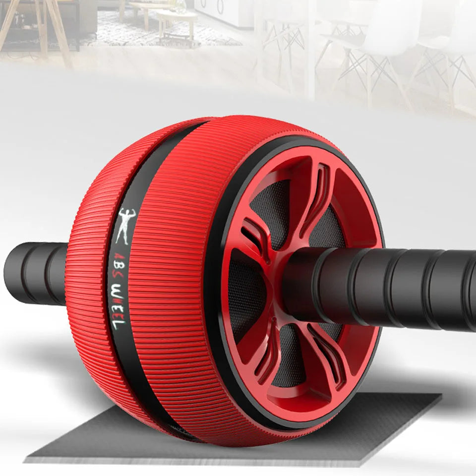 Roue abdominale double rouge large posée sur un tapis